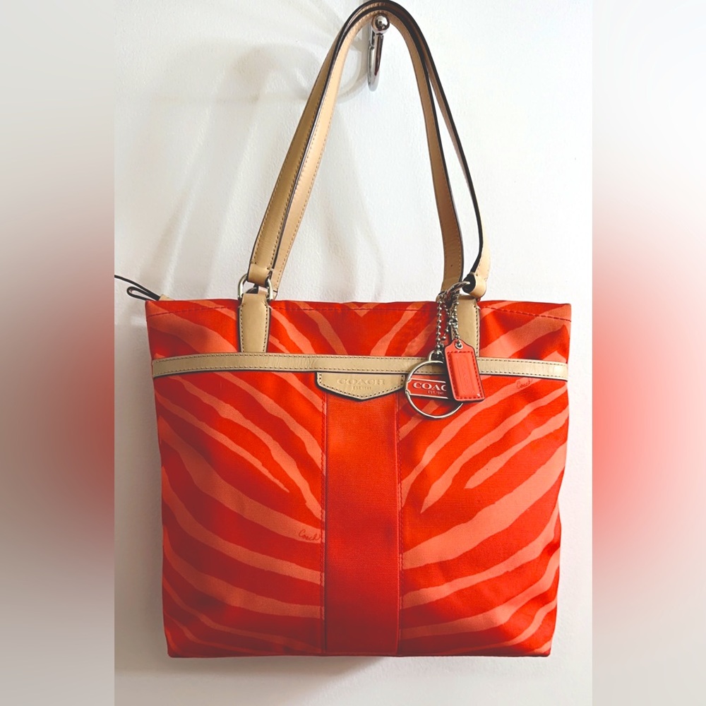COACH, EUC Canvas Zebra Print Tote Bag, MSRP $268, orange and tan with bag charm